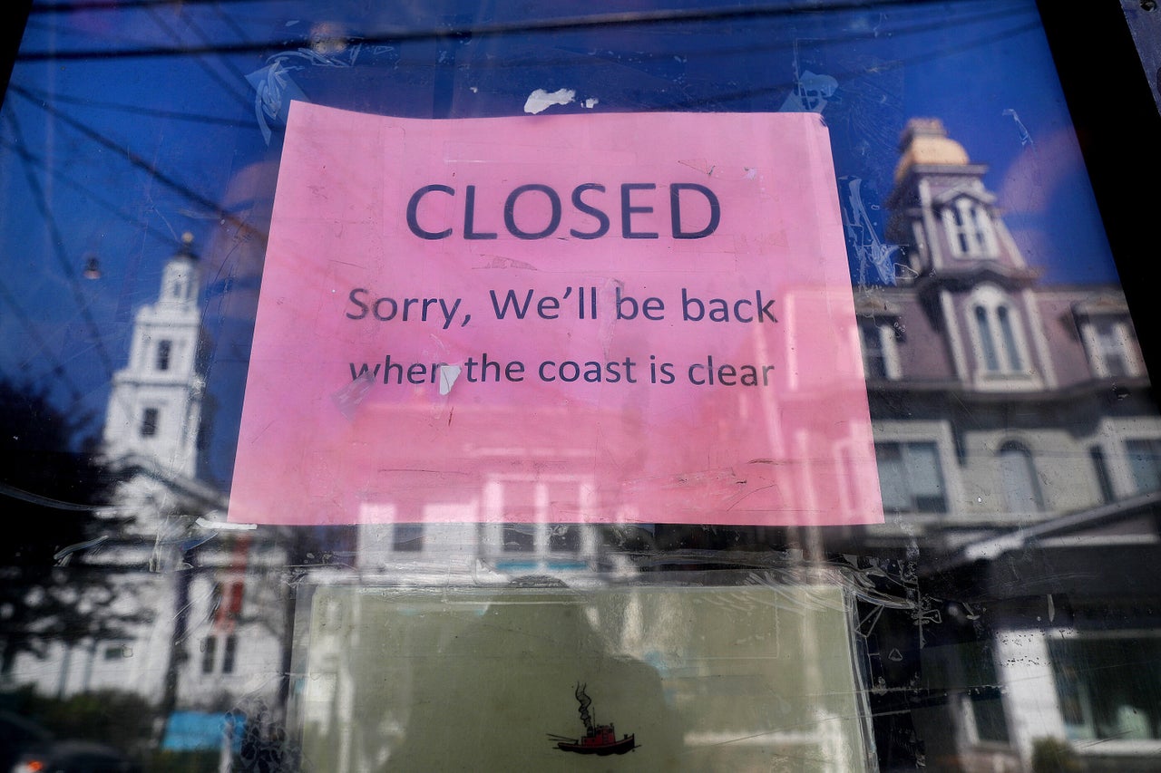 A sign on the Marine Specialties store on Commercial Street in Provincetown tells customers that the store is closed on May 13.