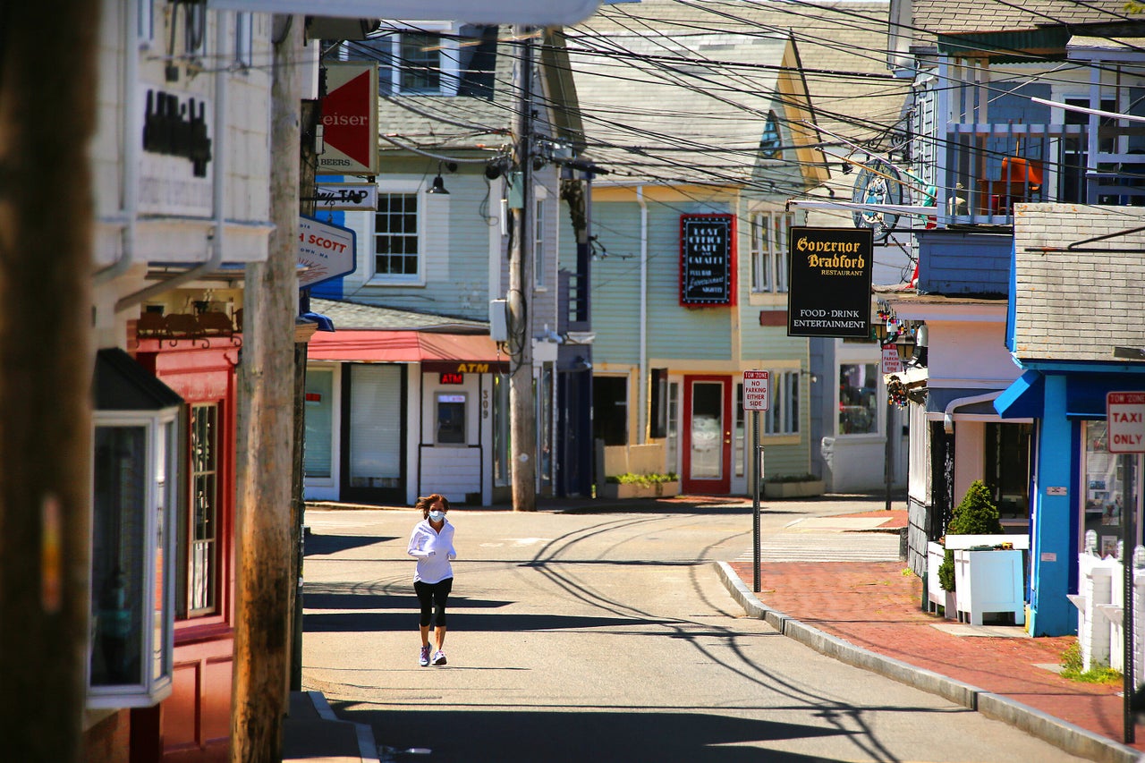 A jogger runs along an empty Commercial Street on May 13. 