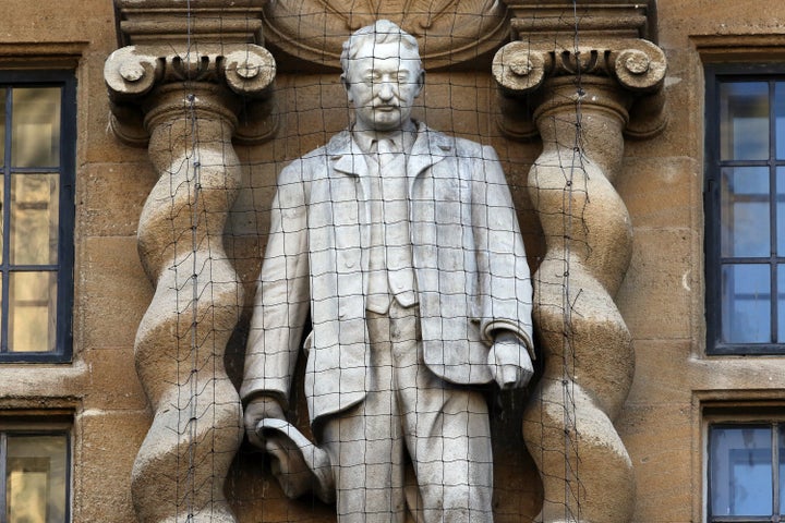 A statue of Cecil Rhodes is displayed on the front of on Oriel College. 