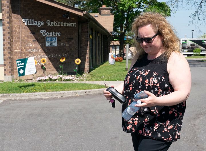 Cathy Parkes leaves Orchard Villa long-term care home in Pickering, Ont. on May 26, 2020. 