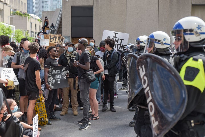 Montreal Police and protesters face off during a march against police brutality and racism in Montreal on on June 7 2020.