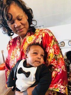 Trey's mom, a.k.a. the Jamaican Baby Whisperer, with Trey's son