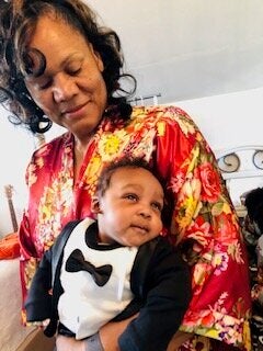 Trey's mom, a.k.a. the Jamaican Baby Whisperer, with Trey's son