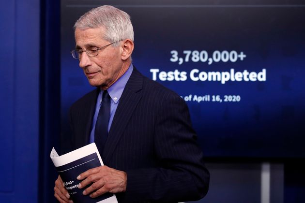Dr. Anthony Fauci, director of the National Institute of Allergy and Infectious Diseases, walks from...