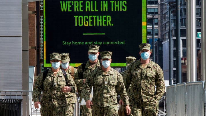 U.S. military personnel wear face masks at the Jacob K. Javits Convention Center in New York City.