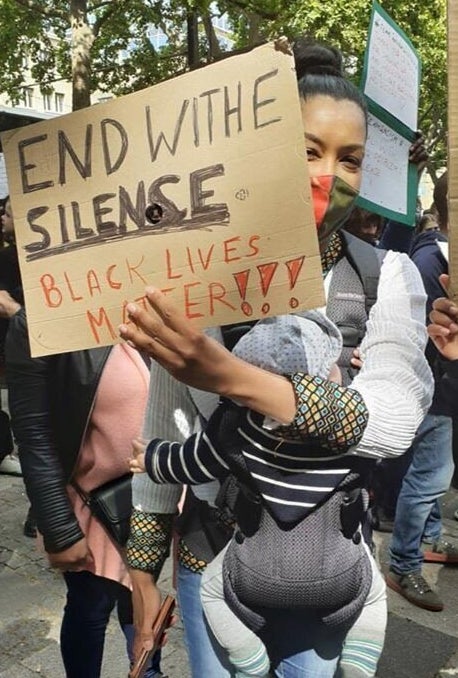 Phyllis Quartey, a social worker who deals with refugees, at a protest in Berlin.