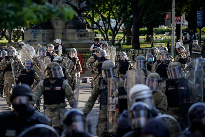 Law enforcement officers are seen responding to a protest near Lafayette Park ahead of President Trump's trip to St. John's Church on June 1.