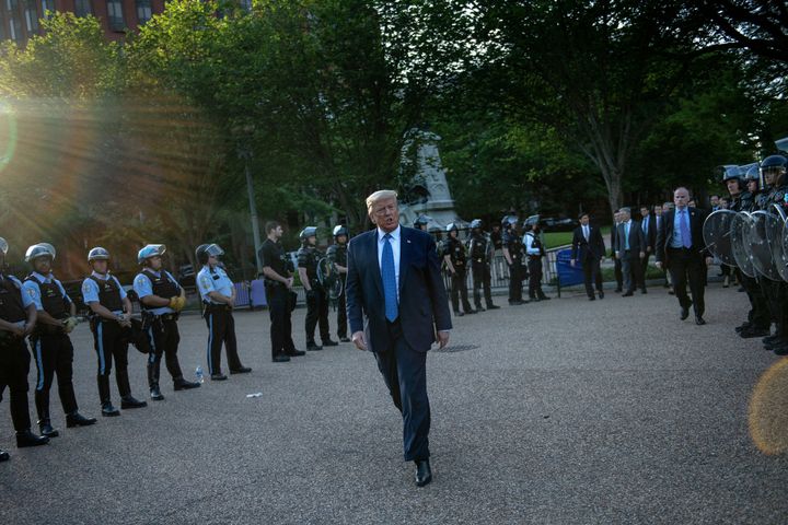 President Donald Trump leaves the White House on foot to go to St John's Episcopal church, across from Lafayette Park, where he posed with a Bible.