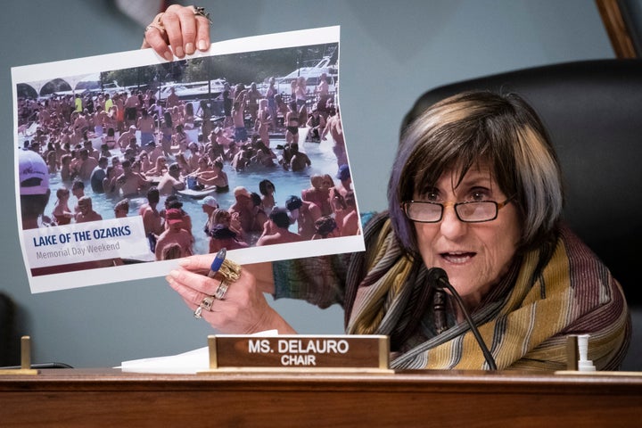 Rep. Rosa DeLauro (D-Conn.) holds up a photograph of partygoers in Lake of the Ozarks, Missouri, celebrating Memorial Day weekend without social distancing.