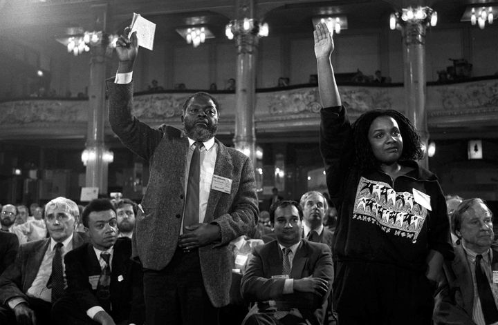On their feet, MPs Bernie Grant and Diane Abbott, watched by MP Paul Boateng (far left), at the Labour Party annual conference in Blackpool. 