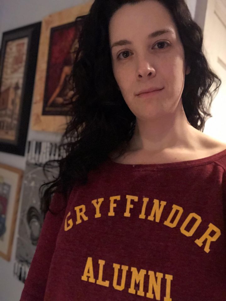 The author showing off some House Pride. They wore this sweatshirt to see "Harry Potter and the Cursed Child" for their birthday several years ago.