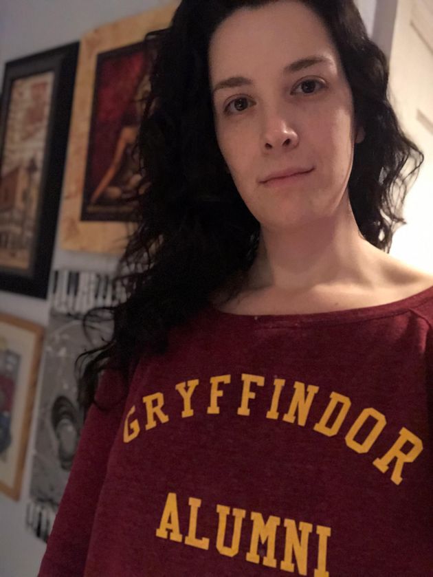 The author showing off some House Pride. They wore this sweatshirt to see Harry Potter and the Cursed Child for their birthday several years ago.