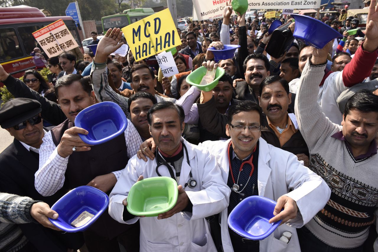 Not much has changed. In this photo, municipal corporation employees including doctors, medical staff, teachers can be seen begging with bowls during a protest march against nonpayment of their salaries on February 2, 2016 in New Delhi.
