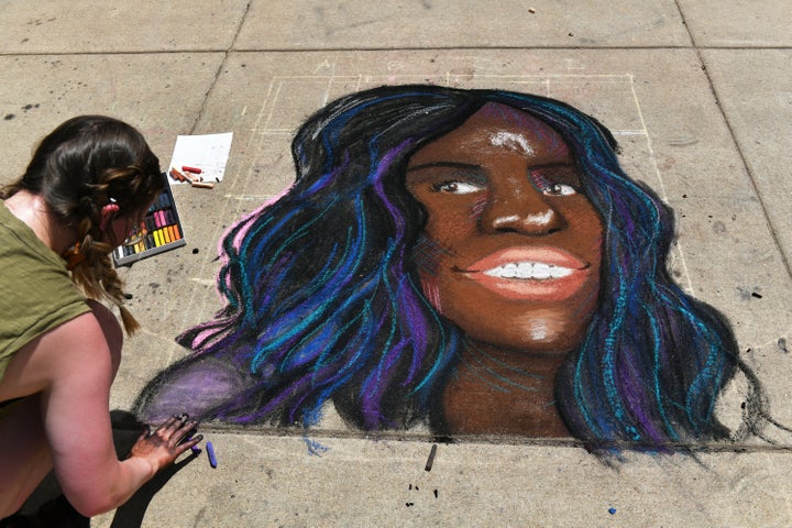 An artist drawing a portrait of Breonna Taylor in front of the Colorado State Capitol building in Denver on June 5.