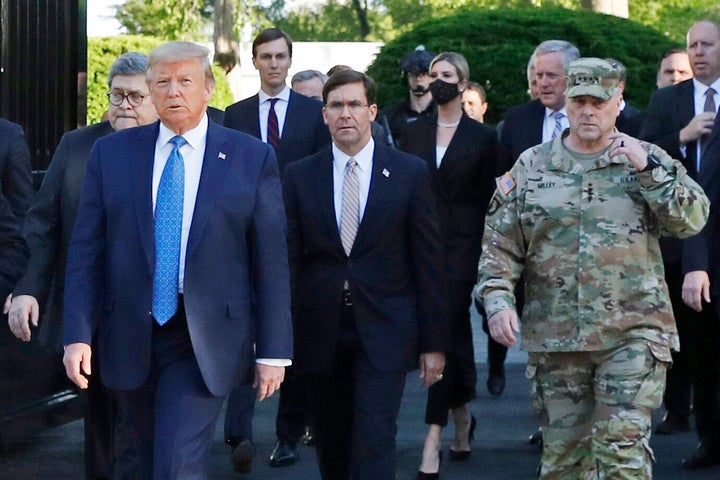 Walking behind President Donald Trump from left are, Attorney General William Barr, Secretary of Defense Mark Esper and Gen. Mark Milley, chairman of the Joint Chiefs of Staff.
