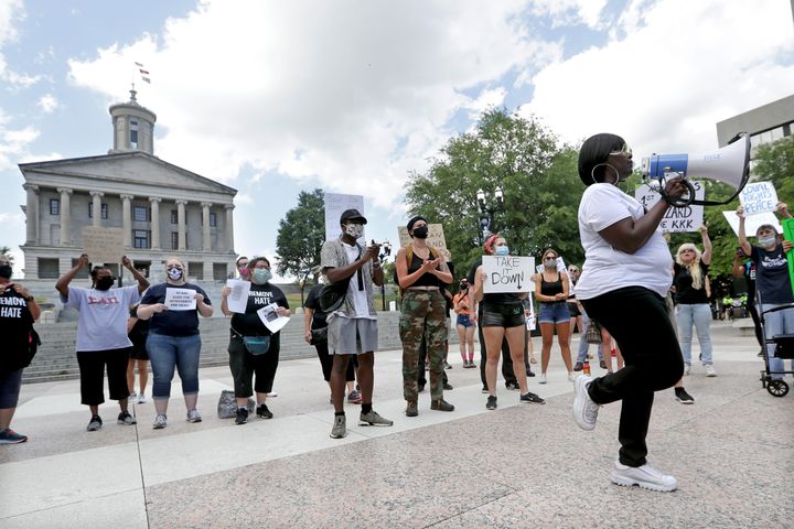 Venita Lewis, right, led a demonstration Wednesday in Nashville that demanded the removal of a bust of Nathan Bedford Forrest from inside the State Capitol.