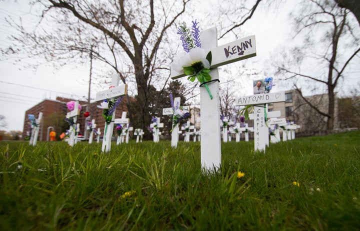 Crosses with flowers for residents who have lost their lives due to COVID-19 outside the Camilla Care Community in Mississauga, Ont. on May 12, 2020.