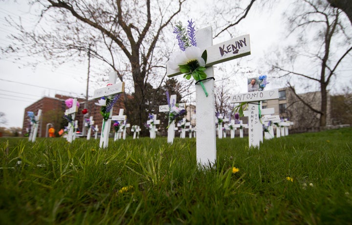 Crosses with flowers for residents who have lost their lives due to COVID-19 outside the Camilla Care Community in Mississauga, Ont. on May 12, 2020. 