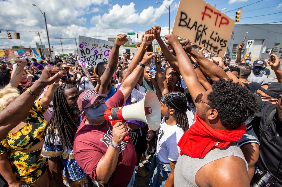 28 Protest Images From Small Cities And Towns Across The
U.S. 3 Protesters raise their fists as Bishop Freddie Marshall of Christ Cathedral of the Triad speaks using a bullhorn in Greensbor