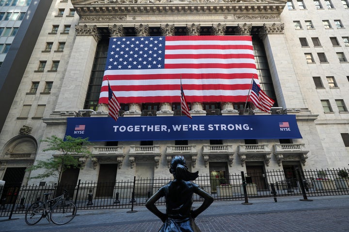 NEW YORK, USA - MAY 26: New York Stock Exchange (NYSE) building is seen with the Fearless Girl Statue during Covid-19 pandemic in Lower Manhattan, New York City, United States on May 26, 2020. Wall Street trading floor partially reopening after coronavirus pandemic shutdown. (Photo by Tayfun Coskun/Anadolu Agency via Getty Images)