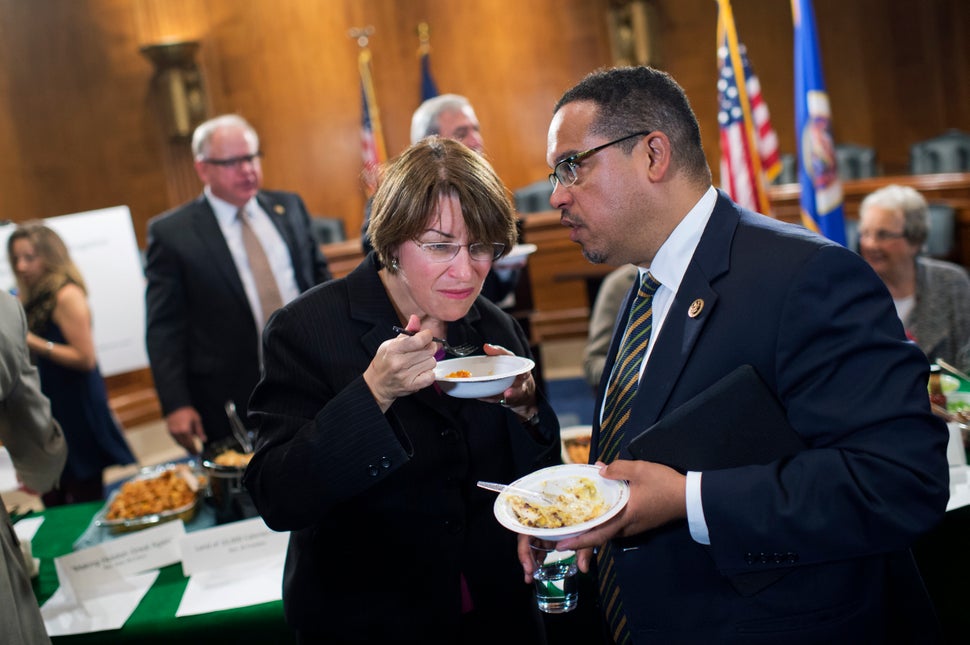 Ellison consults with Sen. Amy Klobuchar (D-Minn.) in Congress in 2016. Despite their ideological differences, they have a lo