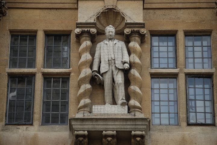 A statue of Cecil Rhodes, the controversial Victorian imperialist who supported apartheid-style measures in southern Africa is seen, mounted on the facade of the Oriel College, in Oxford