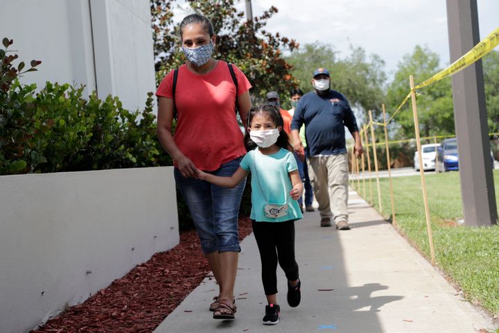 Flora Garcia arrives with her daughter Krislaya Trejo at the Florida Department of Health in Collier County to be tested for 