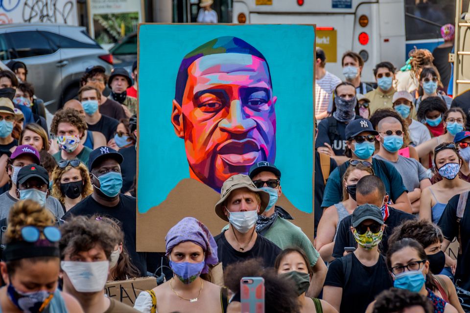 A portrait of George Floyd held by protesters in New York.