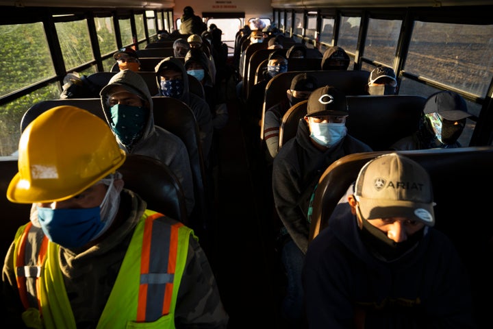 Farm laborers from Fresh Harvest arrive for their shift on April 28, 2020 in Greenfield, California.