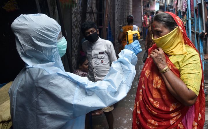 Health workers conducting coronavirus testing drive in Dharavi on June 11, 2020 in Mumbai.
