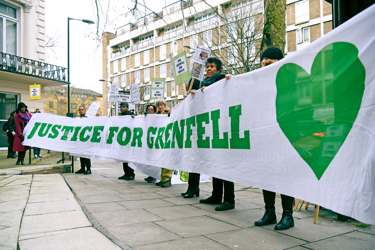 Protesters outside the Grenfell Tower public inquiry in London