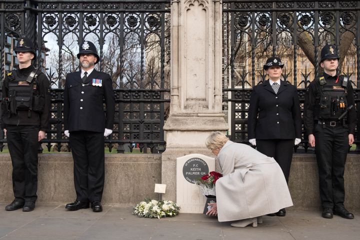 Police officers at the unveiling of a national memorial outside the Carriage Gates in memory of Pc Keith Palmer, who was killed during a terrorist incident in Westminster in 2017 