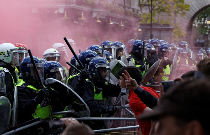 Counter-protestors clash with police as they gather against a Black Lives Matter demonstration following the death of George 