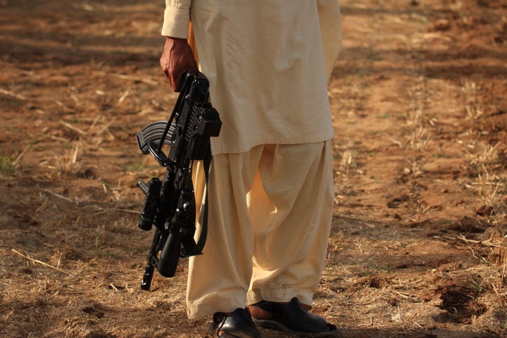 Taliban carrying a gun