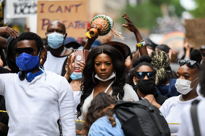 Protesters march against police brutality and racism in Montreal on June 7.