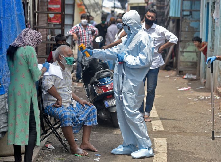 Health workers conducting COVID-19 testing drive in Dharavi on June 14, 2020 in Mumbai.