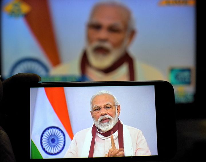 Prime Minister Narendra Modi's address on the Covid19 crisis seen on a smartphone.