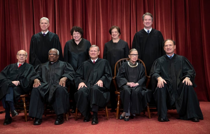 Conservative justices Neil Gorsuch (top row, far left) and Chief Justice John Roberts (bottom row, center) joined the court's four liberal justices in the majority.