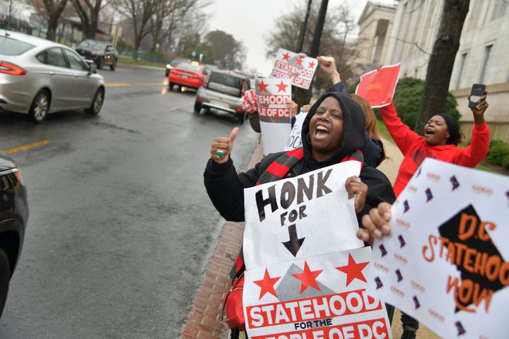 Supporters of statehood for Washington, D.C., cheer as drivers honk their horns in support outside the Rayburn House Office Building on Capitol Hill on Feb. 11, 2020. Statehood advocates are focused on the 2020 election to potentially push their efforts into law.