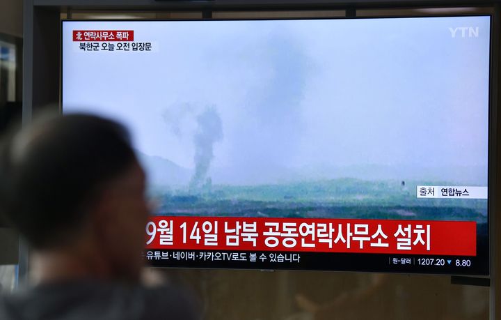 A television news screen shows an explosion of an inter-Korean liaison office in North Korea's Kaesong Industrial Complex.