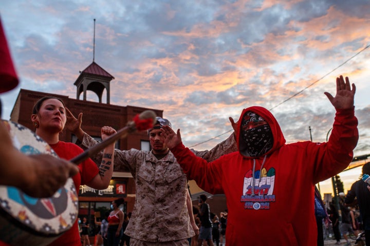 Native Americans pray to call for justice during a demonstration over the killing of George Floyd in Minneapolis.