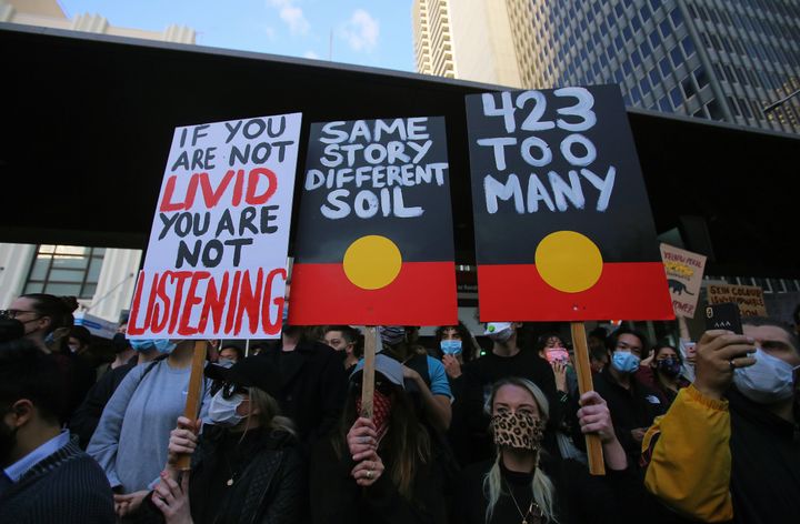 Protesters in Sydney show solidarity with Black Lives Matter demonstrations in the U.S. and rally to stop Aboriginal deaths in police custody.