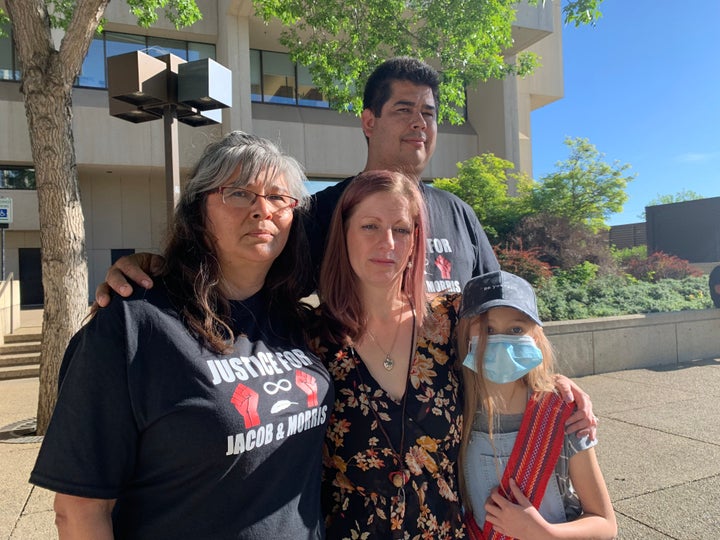 From left to right: Michael Sansom in the back, Ruby Smith, left, Sarah Sansom, centre, and her daughter were at the Edmonton courthouse on Tuesday to oppose the bail request by the accused.