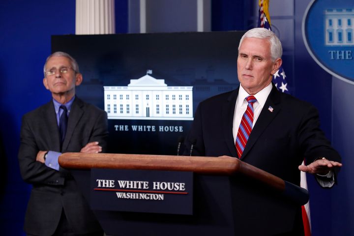 In this April 13 file photo, Dr. Anthony Fauci, director of the National Institute of Allergy and Infectious Diseases, listens as Vice President Mike Pence speaks about the coronavirus during a White House press briefing.