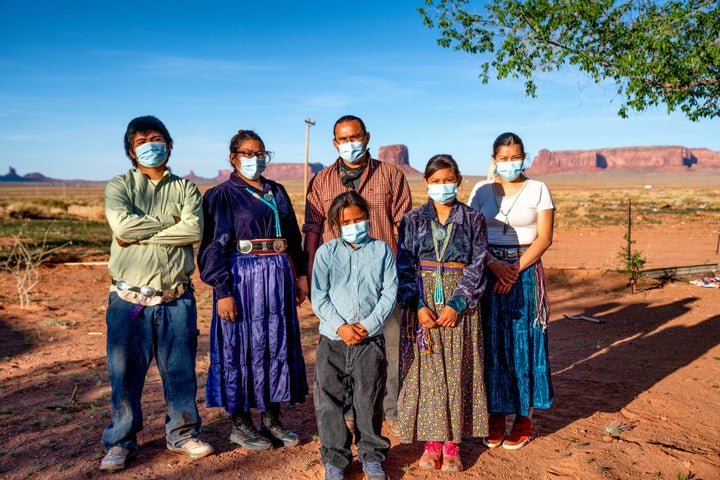 A Navajo family wears masks to protect against the spread of COVID-19 in Monument Valley, Arizona.