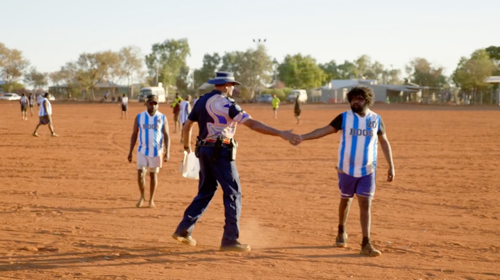 Senior Sergeant Revis Ryder coaches the local footy team in Warakurna. 