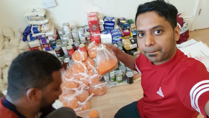 The author, packing food parcels for his local community