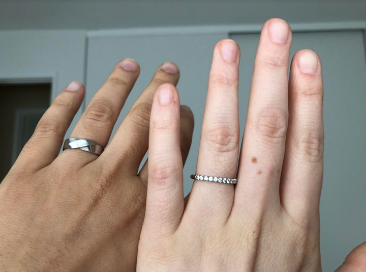 The author and her fiancée, Kristina, display their engagement/wedding bands.