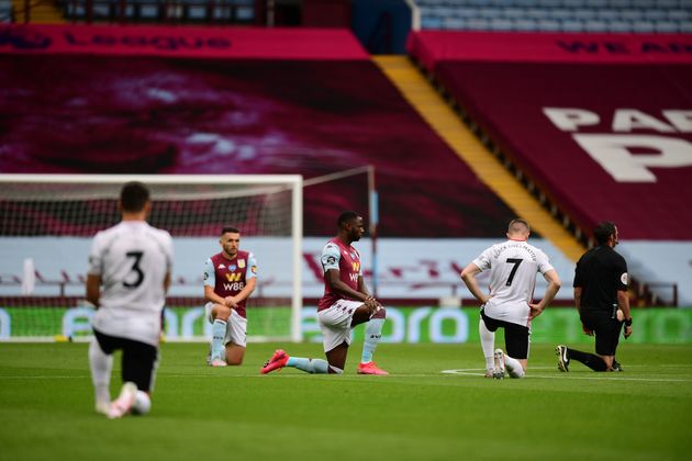 Players kneel prior to the start of the Premier League match between Aston Villa and Sheffield United at Villa Park in Birmingham.