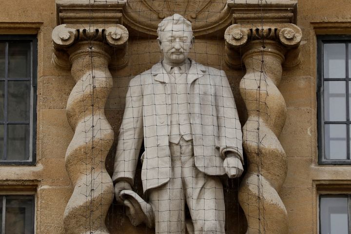A statue of Cecil Rhodes, the controversial Victorian imperialist who supported apartheid-style measures in southern Africa, at Oriel College in Oxford.